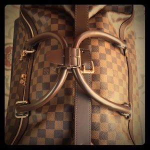 Luis Vuitton carry or pull vintage luggage